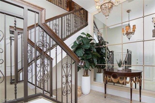 tiled entrance foyer featuring a chandelier