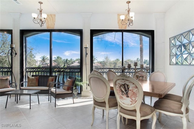 tiled dining area featuring a notable chandelier