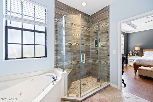 bathroom with plus walk in shower, wood-type flooring, and crown molding