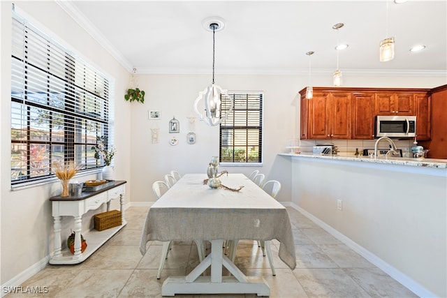 dining space featuring light tile patterned floors and ornamental molding