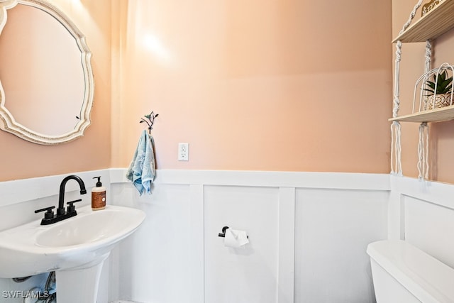 bathroom with sink and toilet