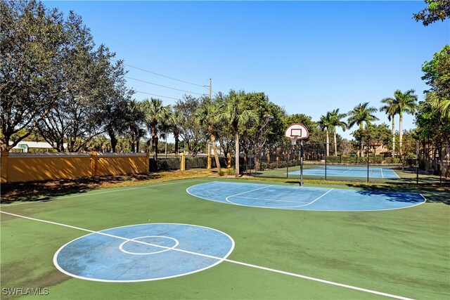 view of sport court featuring tennis court