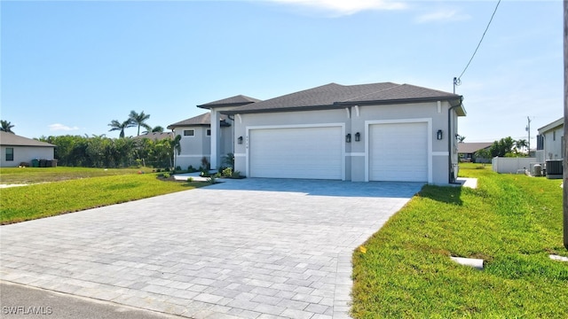 view of front of home featuring a garage and a front lawn