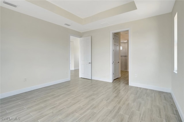 unfurnished room with light hardwood / wood-style floors