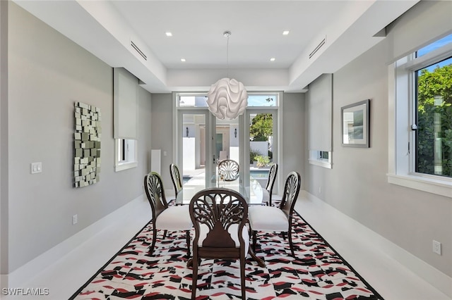 dining room with a notable chandelier