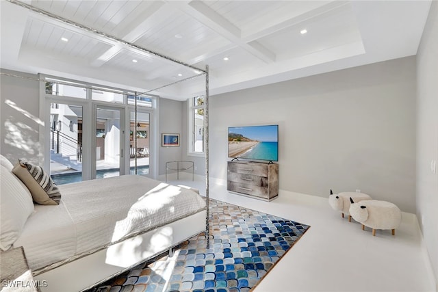 bedroom with beamed ceiling, access to outside, and french doors