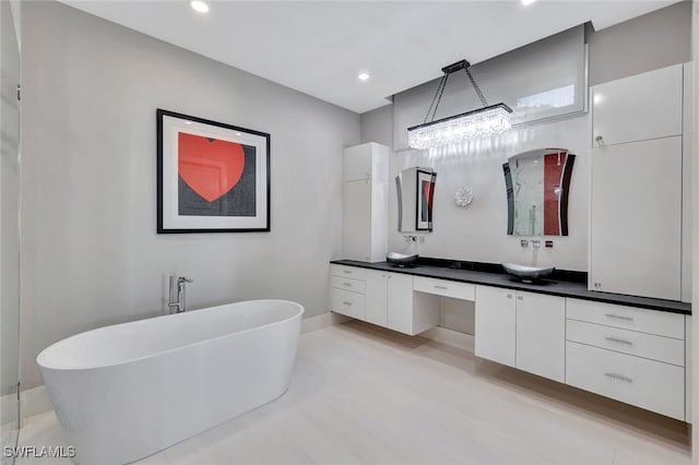 bathroom featuring a bathing tub and vanity