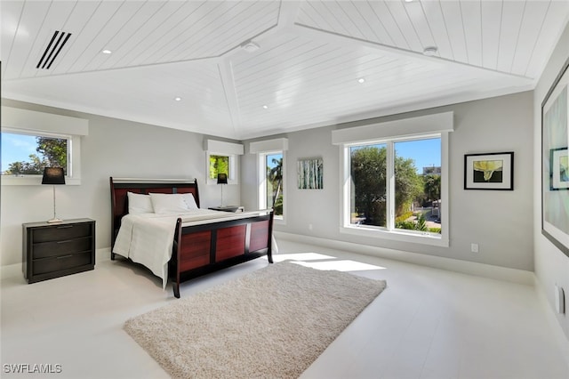 bedroom featuring vaulted ceiling, wood ceiling, and multiple windows