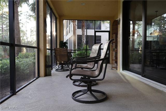 sunroom / solarium featuring a healthy amount of sunlight