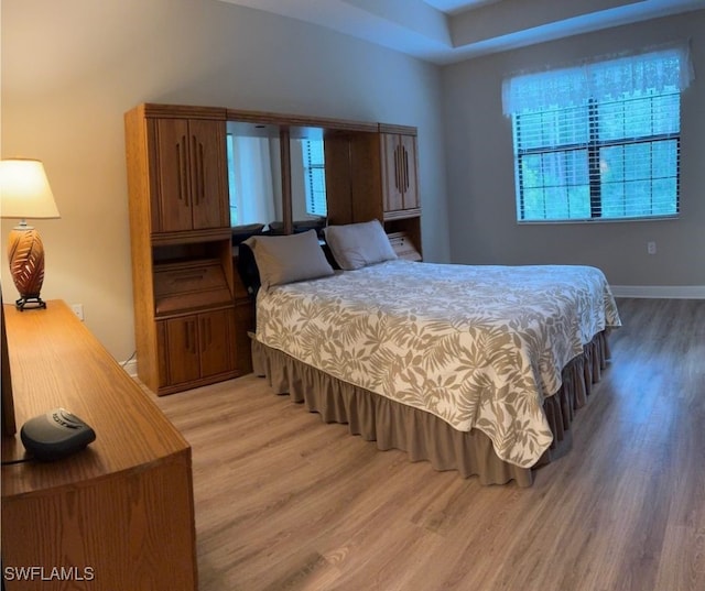 bedroom with wood-type flooring