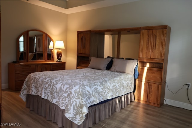 bedroom featuring hardwood / wood-style floors