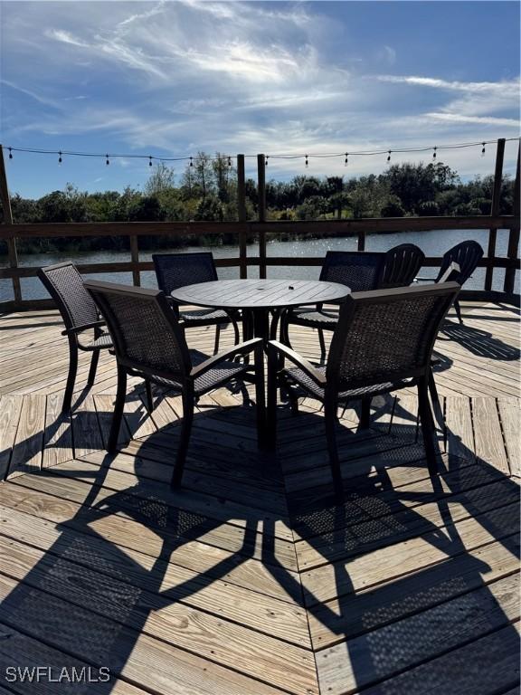 wooden deck featuring a water view