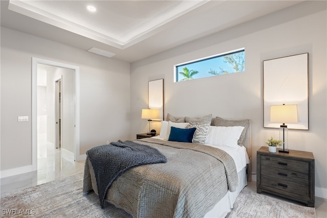 bedroom featuring a tray ceiling