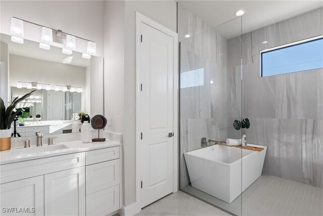 bathroom with a bathing tub and vanity