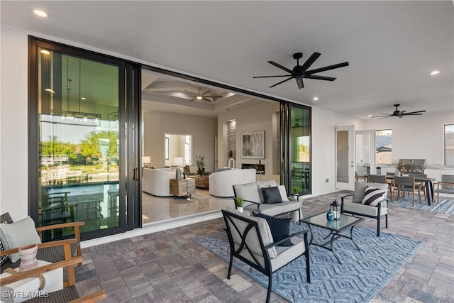 view of patio / terrace with ceiling fan and outdoor lounge area