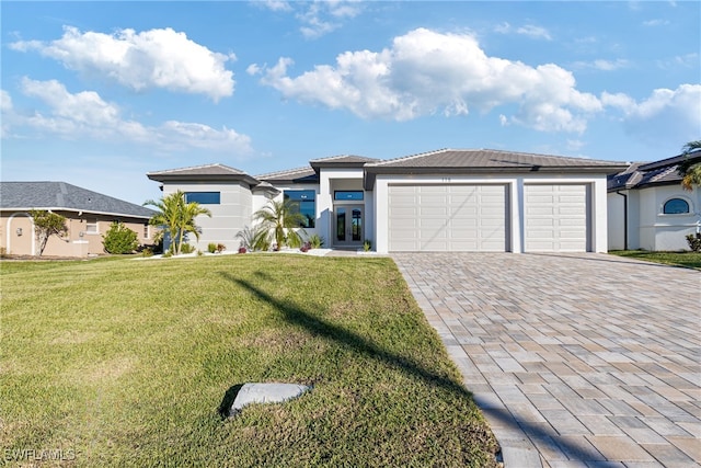 view of front of house featuring a garage and a front yard