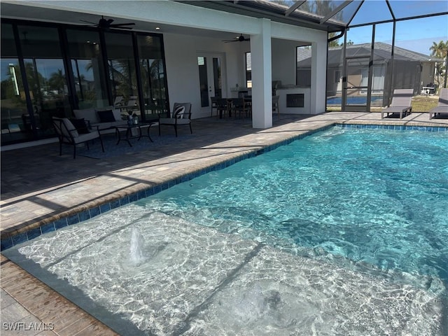 view of swimming pool with a patio and ceiling fan