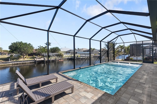 view of swimming pool featuring a water view, glass enclosure, and a patio area