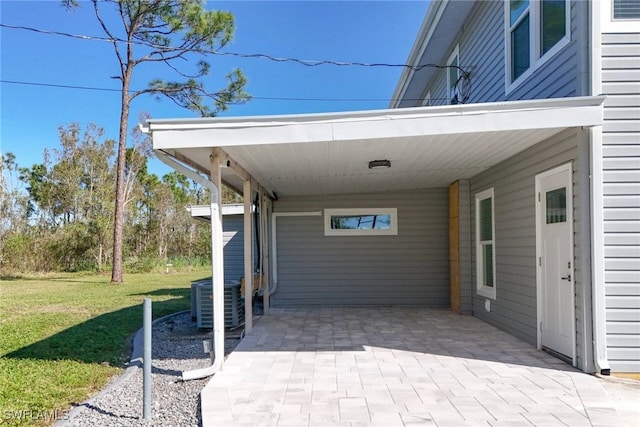 view of patio / terrace featuring a carport and central AC