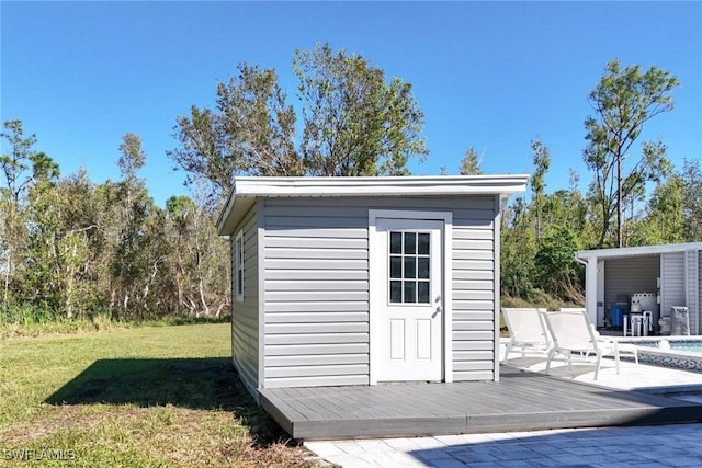 view of outdoor structure featuring a lawn