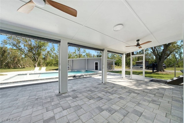 exterior space with ceiling fan and a patio