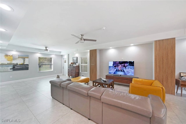 living room featuring ceiling fan and light tile patterned floors