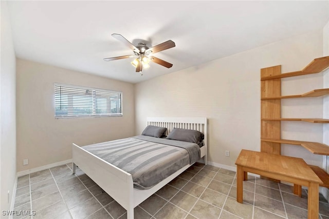 tiled bedroom with ceiling fan