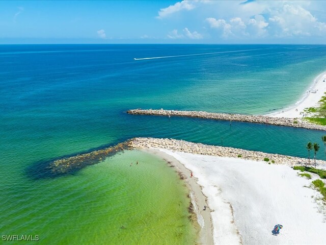 aerial view featuring a water view and a view of the beach