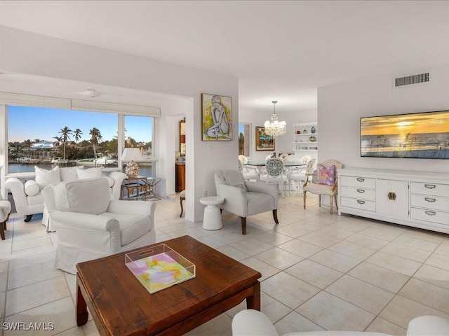 1930 Gulf Shore Blvd N Unit D301, Naples, FL 34102 - living area featuring a chandelier and light tile patterned floors