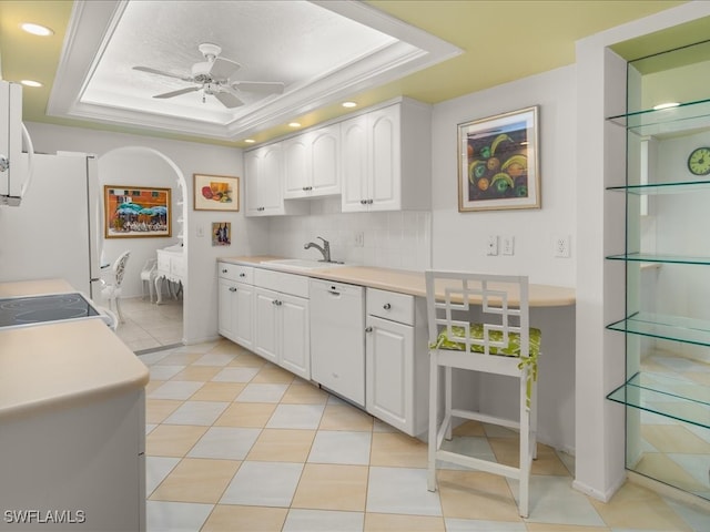 kitchen with ceiling fan, white cabinetry, white appliances, and a tray ceiling