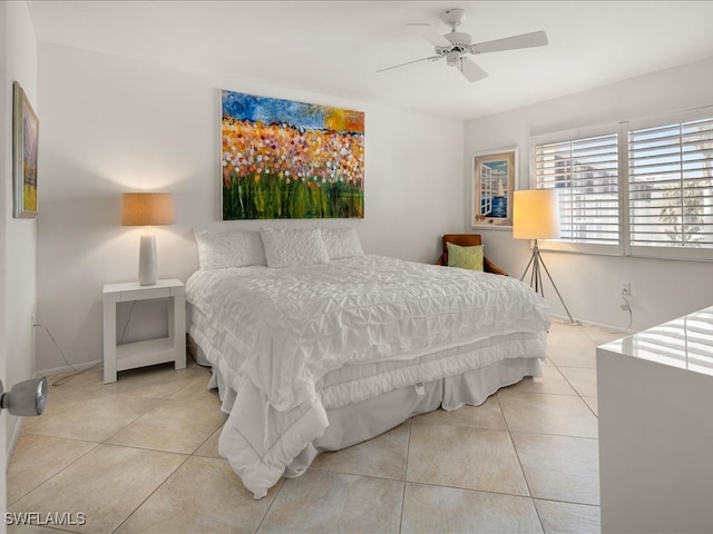 tiled bedroom with ceiling fan