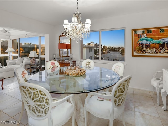 tiled dining area with a notable chandelier