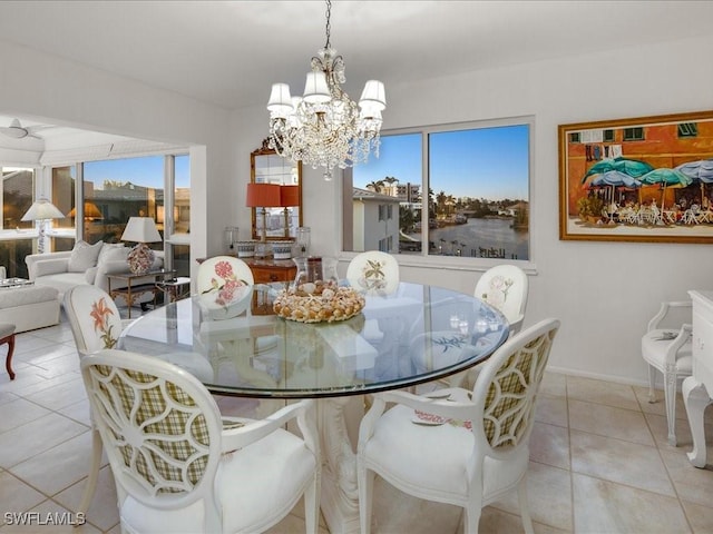 1930 Gulf Shore Blvd N Unit D301, Naples, FL 34102 - dining room featuring a chandelier, tile patterned flooring, and baseboards
