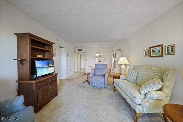 living room with light colored carpet and a textured ceiling