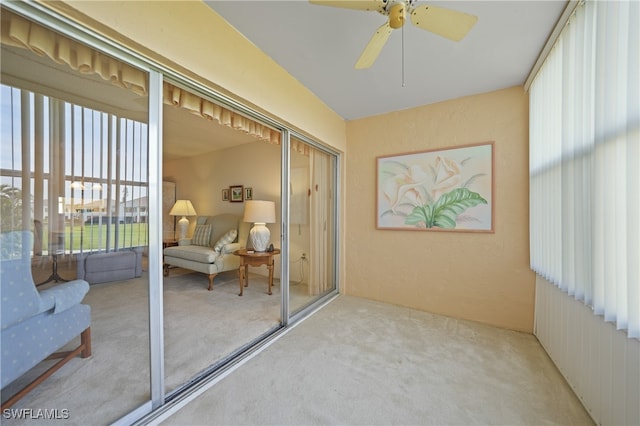 sunroom featuring ceiling fan