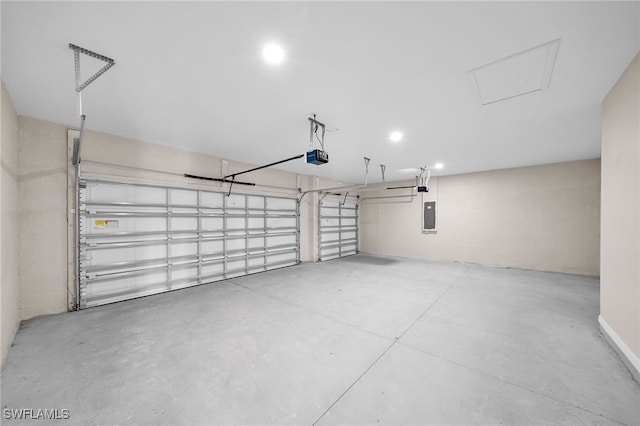 garage with electric panel and a garage door opener