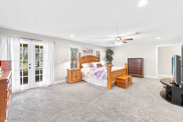 bedroom with access to exterior, french doors, light colored carpet, and ceiling fan