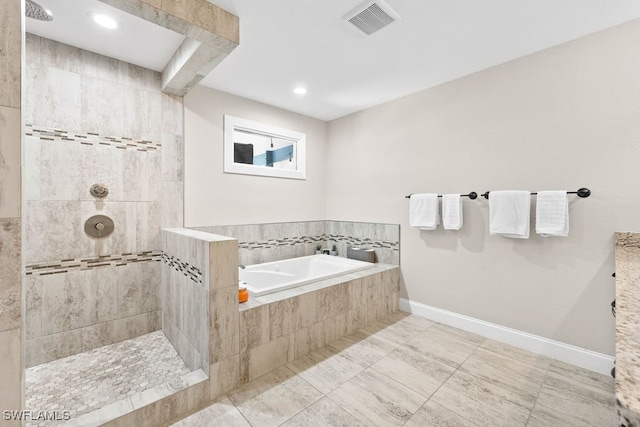 bathroom with tile patterned floors and separate shower and tub