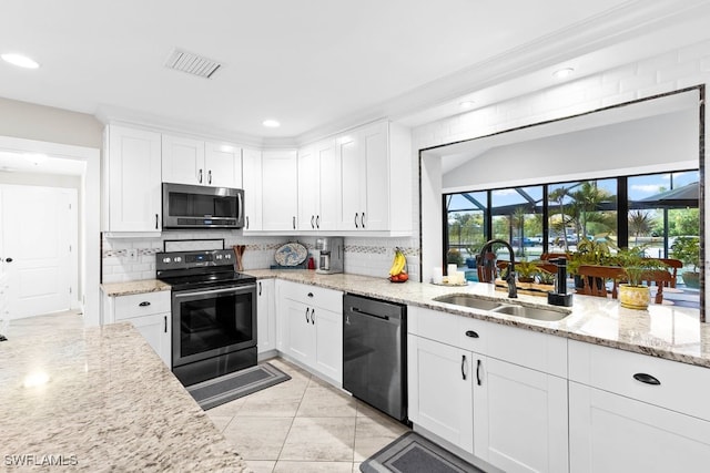 kitchen featuring white cabinets, sink, and stainless steel appliances