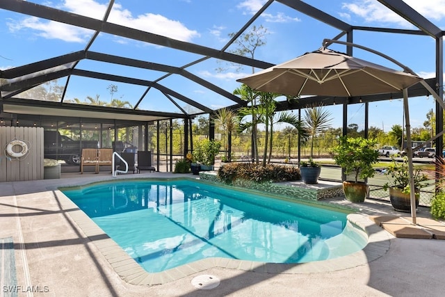 view of pool featuring a patio area and a lanai