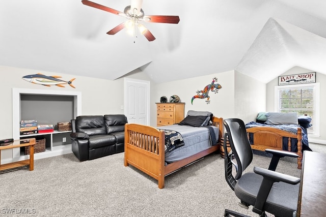 carpeted bedroom featuring ceiling fan, lofted ceiling, and a closet