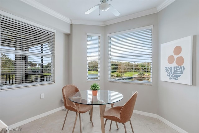 dining space with light tile patterned floors, ornamental molding, and ceiling fan