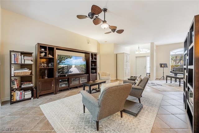 tiled living room featuring ceiling fan