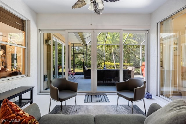 sunroom with ceiling fan and a healthy amount of sunlight