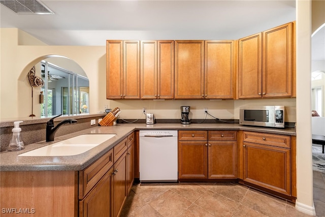 kitchen featuring dishwasher and sink