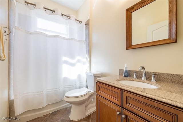 full bathroom with tile patterned floors, vanity, toilet, and shower / bath combo with shower curtain