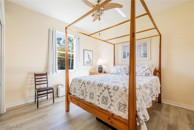 bedroom featuring ceiling fan and light hardwood / wood-style floors