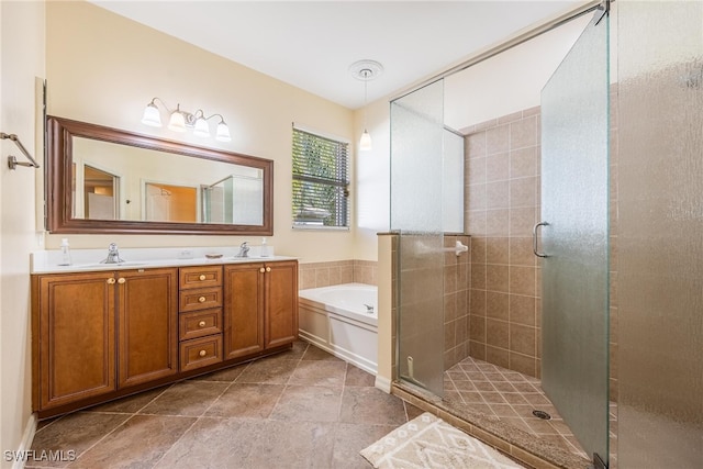 bathroom featuring tile patterned floors, vanity, and plus walk in shower