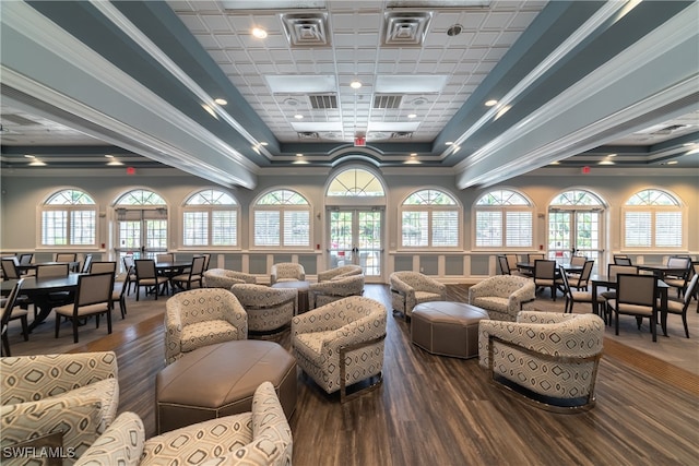 living room featuring crown molding, french doors, and hardwood / wood-style floors