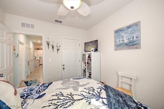 bedroom with ceiling fan and light tile patterned flooring